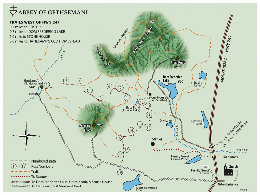 Printed trail map of the Abbey property showing marked paths, knobs, and lakes
